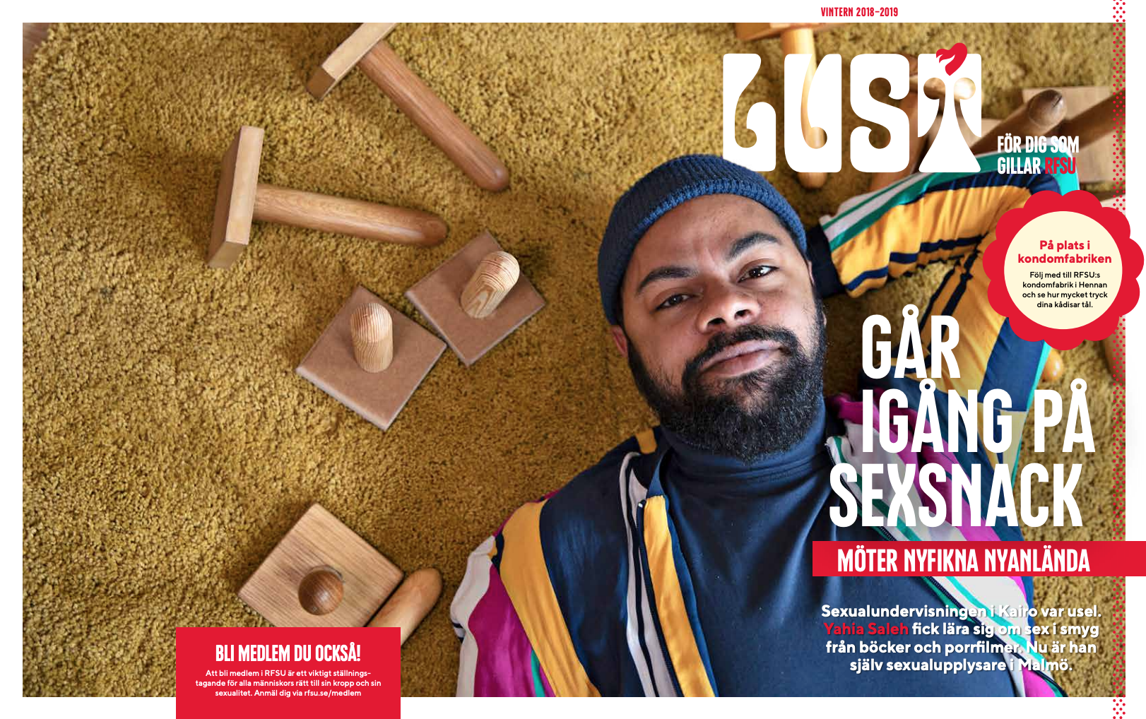 Omslaget av första numret av tidningen Lust. En man med mössa ligger på en gul matta med flera träpenisar runtomkring.